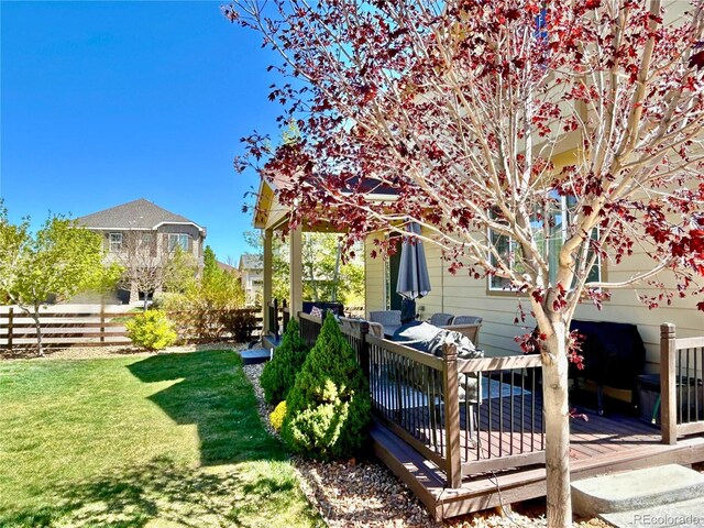 10995 Quintero St, Commerce City, CO 80022 - view of yard featuring a deck