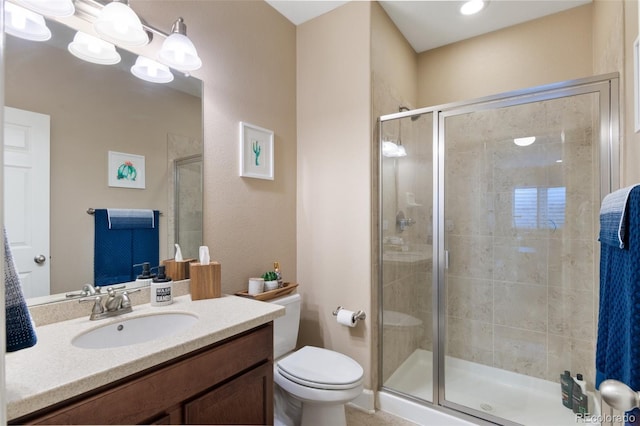 10995 Quintero St, Commerce City, CO 80022 - bathroom featuring toilet, a stall shower, and vanity