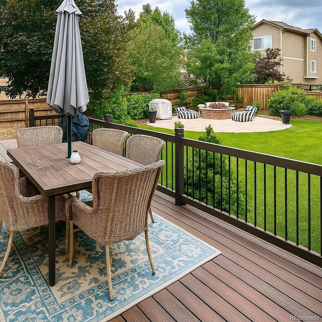 10995 Quintero St, Commerce City, CO 80022 - wooden terrace with a fire pit, a patio, and outdoor dining space