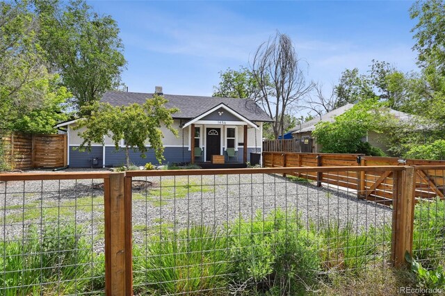 1456 Syracuse St, Denver, CO 80220 - view of front of property featuring a fenced front yard and roof with shingles