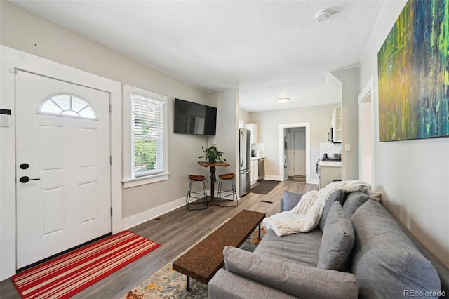 1456 Syracuse St, Denver, CO 80220 - entrance foyer featuring dark wood-style floors and baseboards