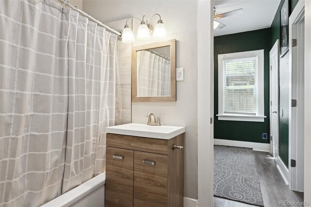 1456 Syracuse St, Denver, CO 80220 - bathroom with vanity, wood finished floors, and baseboards