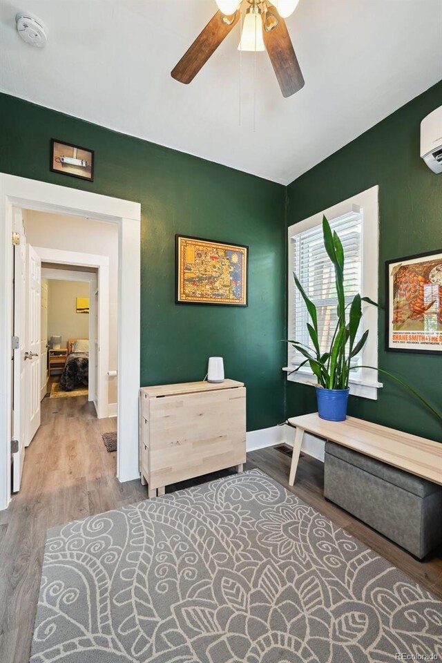 1456 Syracuse St, Denver, CO 80220 - home office featuring wood finished floors, a ceiling fan, and baseboards