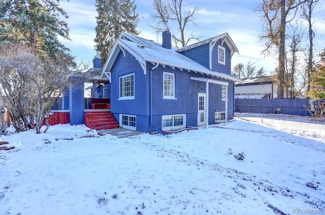 5725 W Mississippi Ave, Lakewood, CO 80226 - snow covered rear of property with a chimney