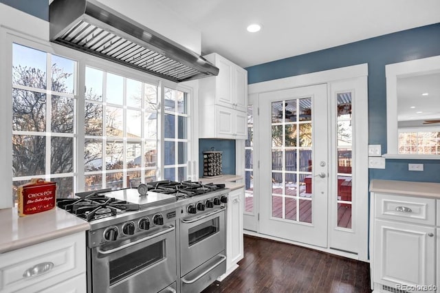 5725 W Mississippi Ave, Lakewood, CO 80226 - kitchen with double oven range, wall chimney range hood, light countertops, white cabinets, and recessed lighting