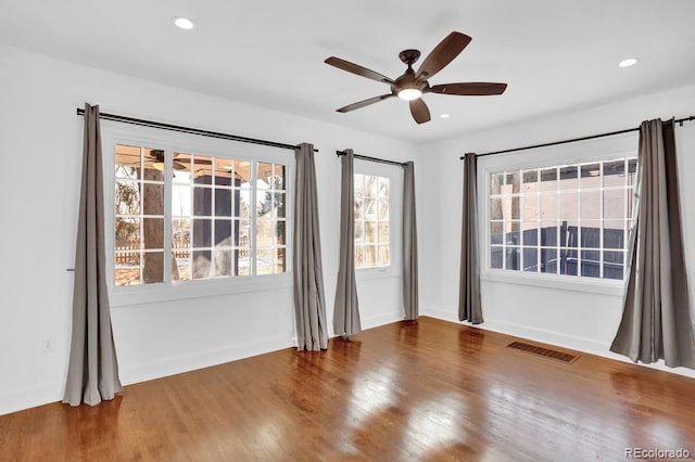 5725 W Mississippi Ave, Lakewood, CO 80226 - unfurnished room featuring a ceiling fan, healthy amount of natural light, wood finished floors, and recessed lighting