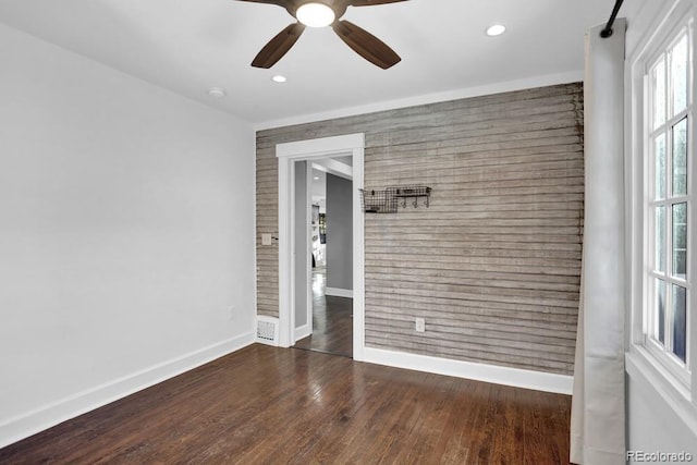 5725 W Mississippi Ave, Lakewood, CO 80226 - spare room featuring baseboards, an accent wall, wood finished floors, a ceiling fan, and recessed lighting
