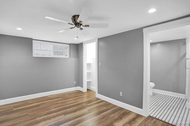 5725 W Mississippi Ave, Lakewood, CO 80226 - unfurnished bedroom featuring recessed lighting, wood finished floors, ensuite bath, ceiling fan, and baseboards