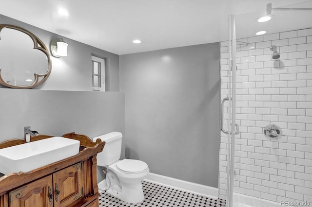 5725 W Mississippi Ave, Lakewood, CO 80226 - bathroom with a stall shower, recessed lighting, toilet, and vanity