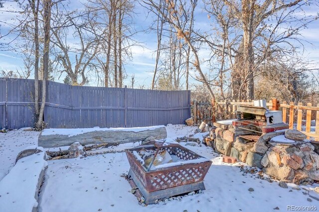 5725 W Mississippi Ave, Lakewood, CO 80226 - snowy yard with a fire pit