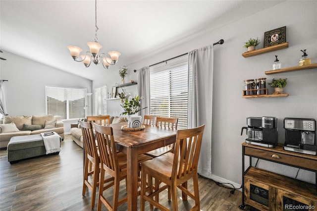 dining space featuring lofted ceiling, a healthy amount of sunlight, and dark hardwood / wood-style floors