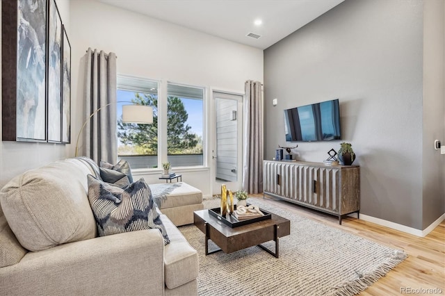 487 Interlocken Blvd Unit 104, Broomfield, CO 80021 - living room with wood finished floors and baseboards