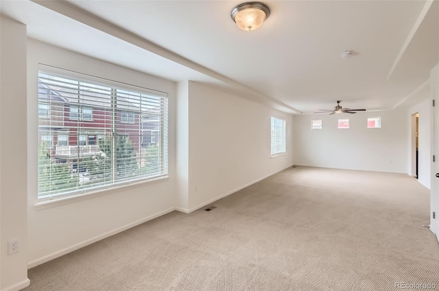 133 Poppy View Ln, Erie, CO 80516 - spare room featuring light colored carpet, ceiling fan, and baseboards