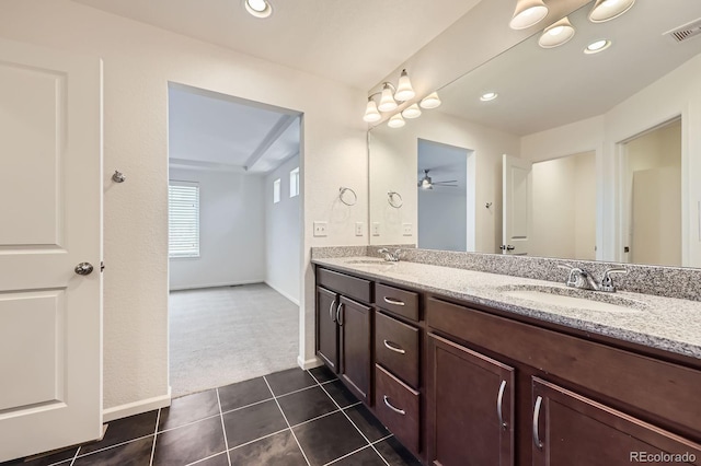 133 Poppy View Ln, Erie, CO 80516 - bathroom with double vanity, tile patterned flooring, recessed lighting, baseboards, and a ceiling fan