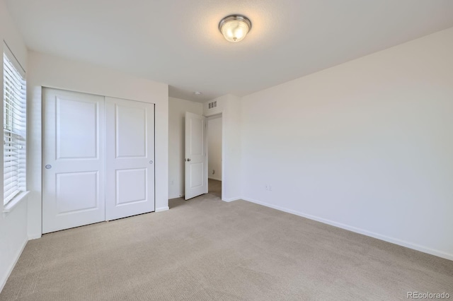 133 Poppy View Ln, Erie, CO 80516 - unfurnished bedroom with carpet floors, a closet, and baseboards