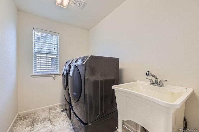 133 Poppy View Ln, Erie, CO 80516 - laundry area featuring independent washer and dryer and baseboards
