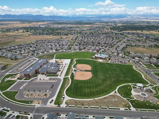 133 Poppy View Ln, Erie, CO 80516 - aerial view of property and surrounding area with a mountainous background and nearby suburban area