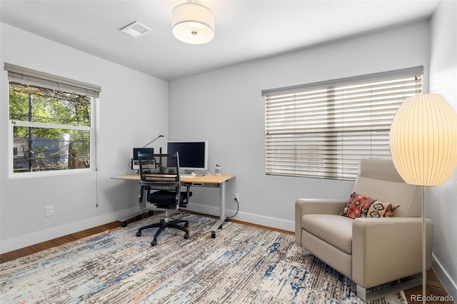 office featuring wood finished floors and baseboards