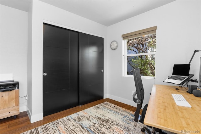 office with baseboards and wood finished floors