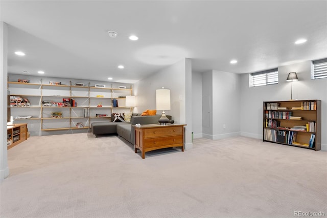 carpeted living room with recessed lighting and baseboards