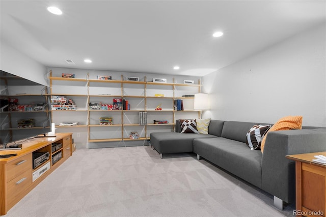 living room with light colored carpet and recessed lighting