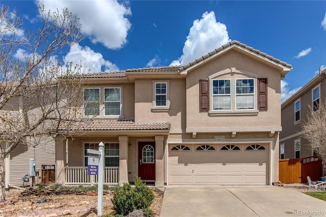 3607 Dinosaur St, Castle Rock, CO 80109 - view of front of property with a tiled roof, stucco siding, driveway, an attached garage, and fence