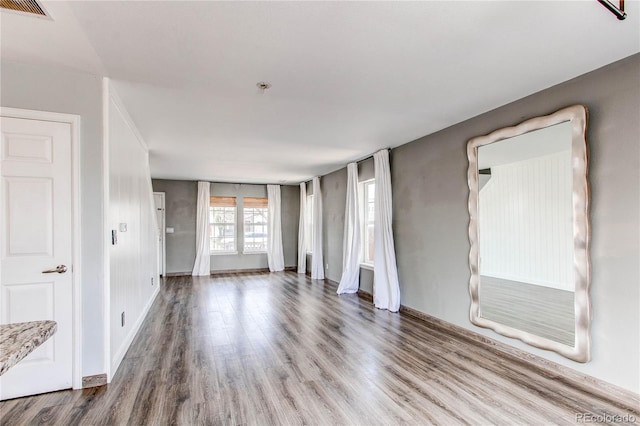 3607 Dinosaur St, Castle Rock, CO 80109 - unfurnished room with wood finished floors, fire sprinkler in ceiling, and baseboards
