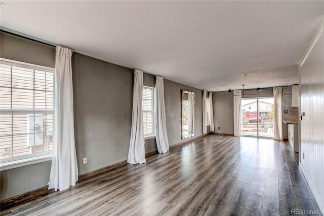 3607 Dinosaur St, Castle Rock, CO 80109 - unfurnished room featuring dark wood finished floors, plenty of natural light, and baseboards