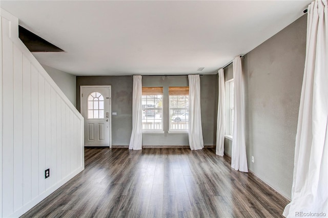 3607 Dinosaur St, Castle Rock, CO 80109 - unfurnished living room featuring dark wood-type flooring, stairway, and baseboards