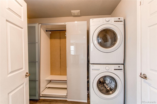 3607 Dinosaur St, Castle Rock, CO 80109 - clothes washing area with stacked washer / drying machine and wood finished floors
