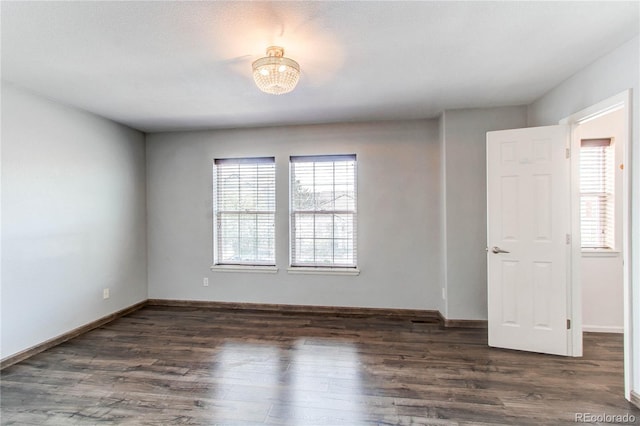 3607 Dinosaur St, Castle Rock, CO 80109 - unfurnished room with plenty of natural light, wood finished floors, and baseboards