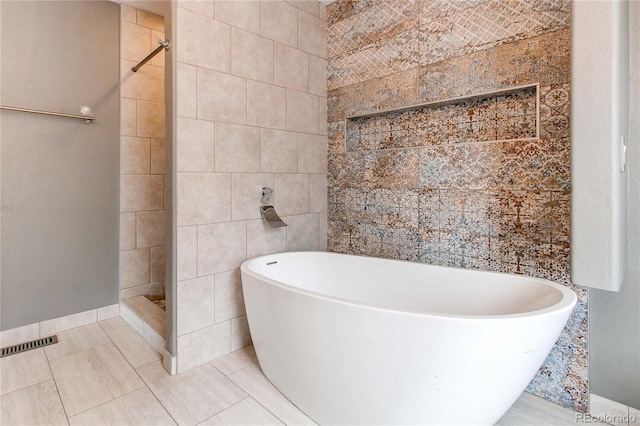 3607 Dinosaur St, Castle Rock, CO 80109 - full bath featuring tiled shower, a soaking tub, tile patterned floors, and tile walls
