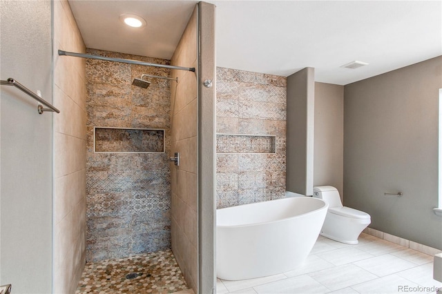 3607 Dinosaur St, Castle Rock, CO 80109 - full bathroom featuring a shower stall, toilet, a freestanding tub, and tile patterned floors