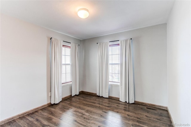 3607 Dinosaur St, Castle Rock, CO 80109 - unfurnished room with healthy amount of natural light, dark wood-type flooring, and baseboards
