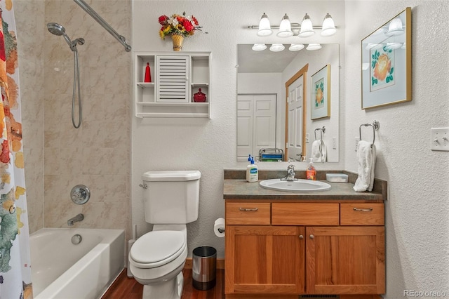 112 Apache Trl, Jefferson, CO 80456 - full bathroom with vanity, toilet, shower / tub combo, wood finished floors, and a textured wall
