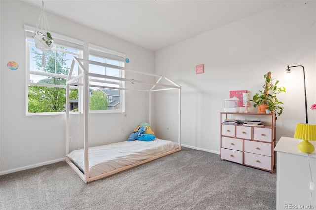 carpeted bedroom with baseboards