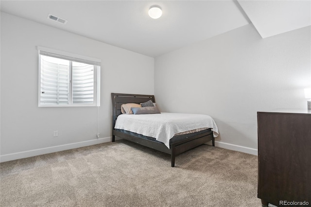 carpeted bedroom with baseboards