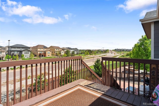 wooden terrace featuring a residential view