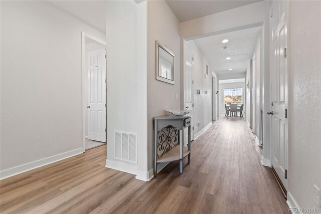 7410 S Old Hammer Way, Aurora, CO 80016 - hallway featuring wood finished floors and recessed lighting