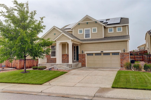 13351 Olive Way, Thornton, CO 80602 - craftsman-style house with stone siding, a garage, roof mounted solar panels, covered porch, and driveway