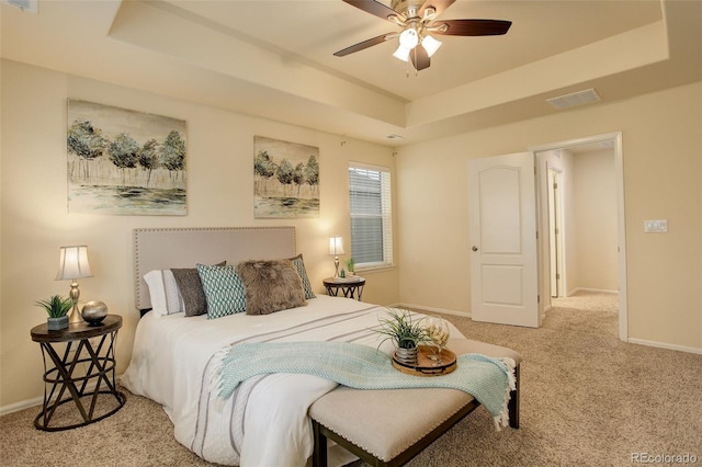 13351 Olive Way, Thornton, CO 80602 - carpeted bedroom with a tray ceiling, baseboards, and ceiling fan