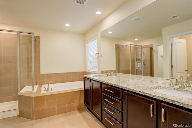13351 Olive Way, Thornton, CO 80602 - full bathroom featuring double vanity, a stall shower, a bath, tile patterned floors, and recessed lighting