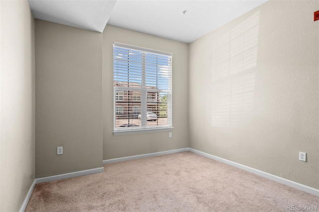 7440 S Blackhawk St Unit 104, Englewood, CO 80112 - empty room featuring carpet and baseboards