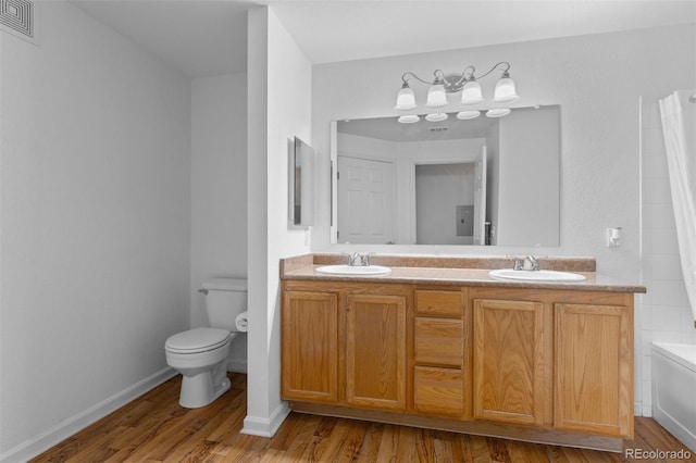 7440 S Blackhawk St Unit 104, Englewood, CO 80112 - bathroom with wood finished floors and double vanity