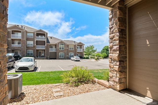 7440 S Blackhawk St Unit 104, Englewood, CO 80112 - uncovered parking lot featuring a residential view