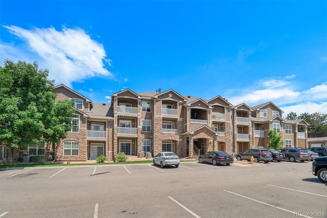 7440 S Blackhawk St Unit 104, Englewood, CO 80112 - view of apartment building / complex with uncovered parking