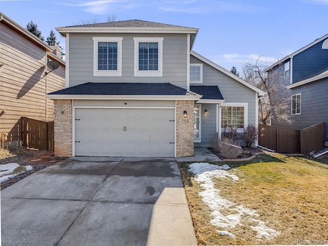 view of front property with a garage and a front lawn