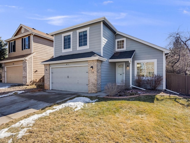 view of front property featuring a garage and a front lawn