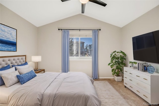 bedroom with lofted ceiling, light colored carpet, and ceiling fan