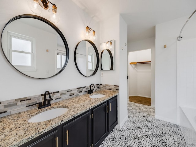 bathroom with vanity, tile patterned flooring, and decorative backsplash